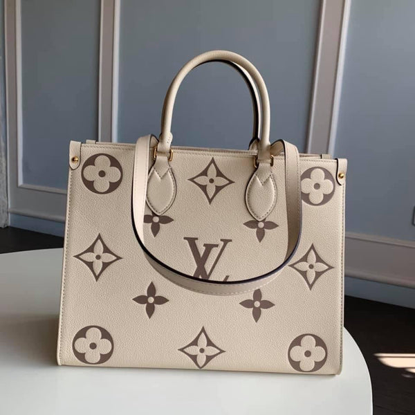 Bicolor OnTheGo PM Bag – Accessorio premium elegante