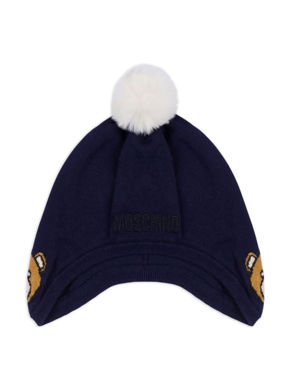 Berretto con pompon per neonato Moschino Kids blu con lavorazione a maglia – Accessorio premium elegante