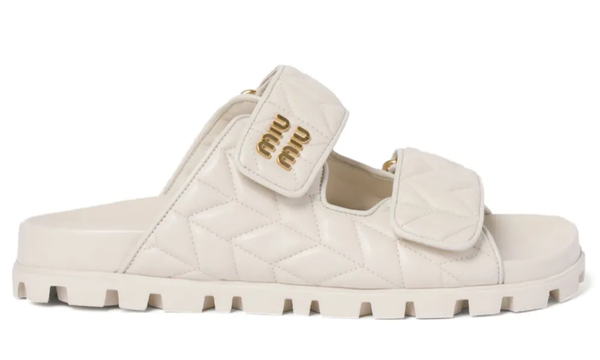 Miu Miu Matelassé Nappa Leather Slides "Optical White" – Accessorio premium elegante