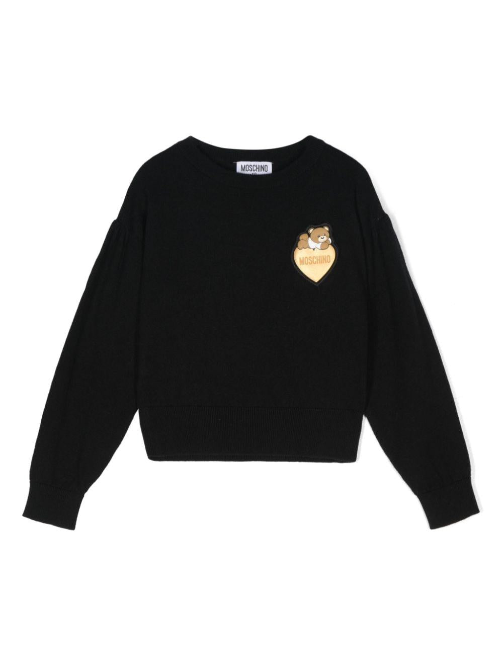 Maglione per bambina Moschino Kids nero con applicazione Teddy Bear – Accessorio premium elegante