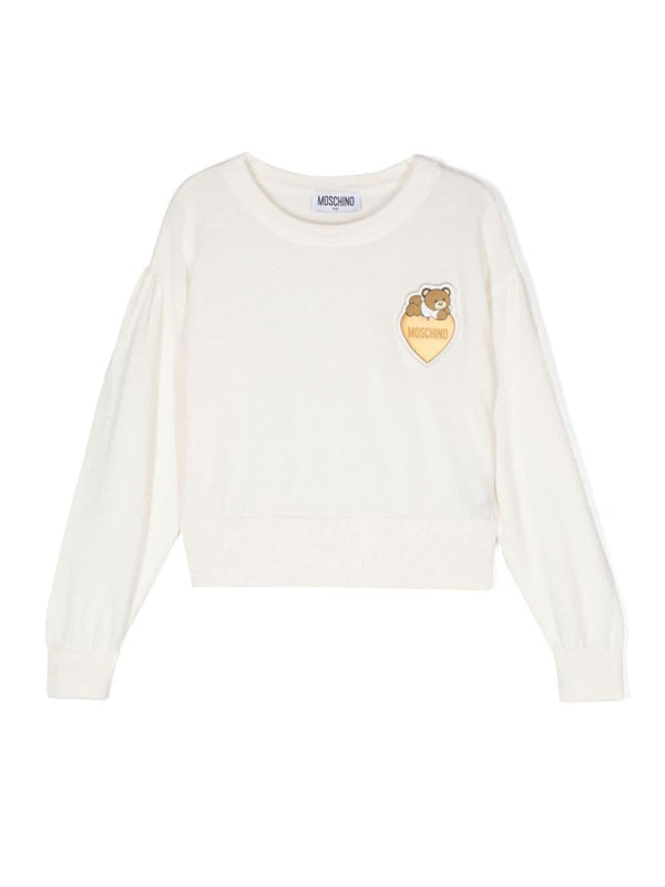 Maglione per bambina Moschino Kids bianco con applicazione Teddy Bear – Accessorio premium elegante